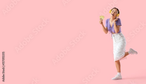 Happy Asian woman with cred...