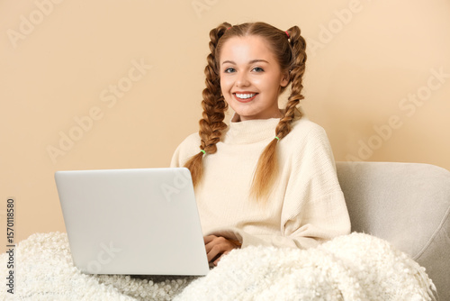 Happy young woman in warm s...