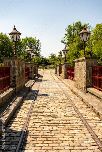 Tramlines over historical stone bridge