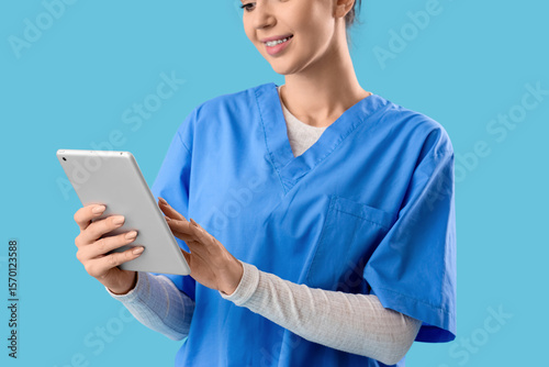 Female medical intern using...