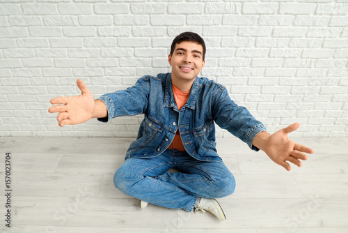 Young man opening arms for ...