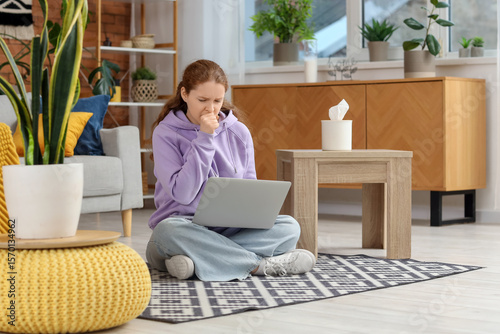 Sick young woman with lapto...