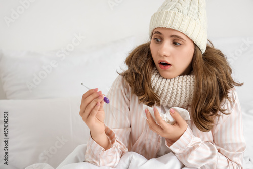 Shocked ill young woman wit...