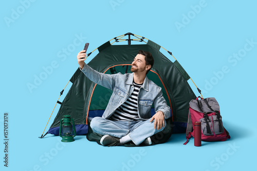 Young male tourist with ten...