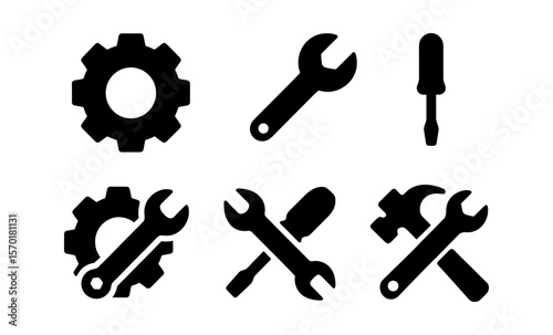 Black tool icons set: wrench, screwdriver, gear silhouettes for industrial design