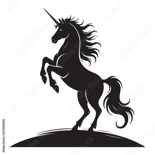 Majestic black silhouette of a powerful unicorn rearing up on its hind legs with a flowing mane and tail on a white background