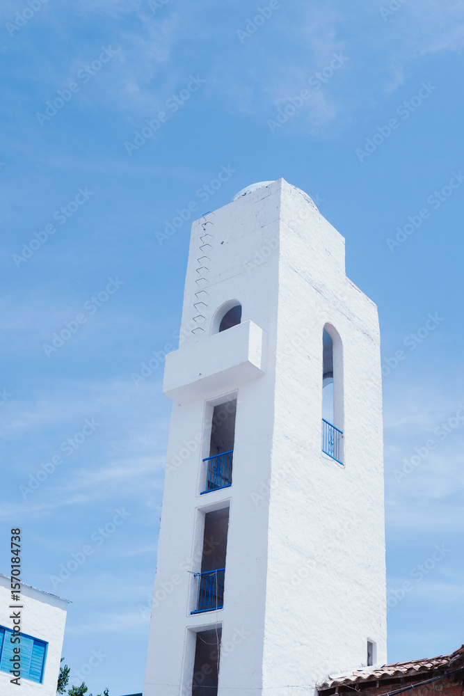 Fototapeta premium Santorini Colombia: a picturesque town with white and blue Greek-style houses in Colombia