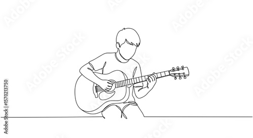Young man playing acoustic guitar while sitting indoors  