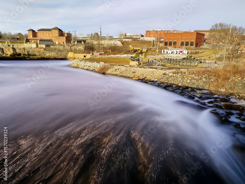 Androscoggin River, Lewisiton Auburn Maine Great Falls location.  Surrounded by historic factories, veterens park and the Lewiston sign.