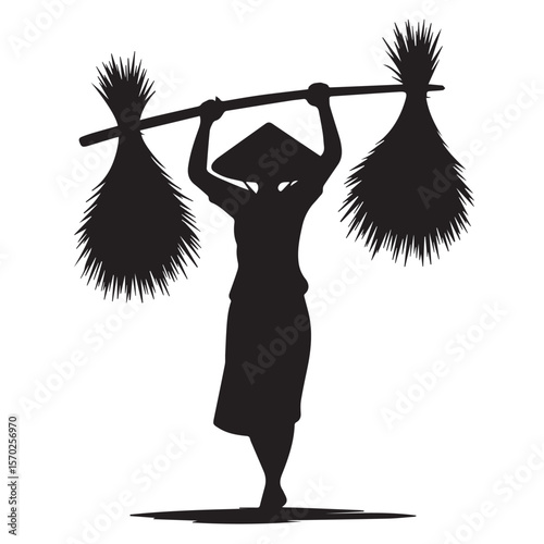 Silhouette of a farmer wearing a conical hat carrying harvested crops on a pole over their shoulders