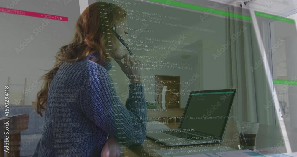 Woman lifting smartphone checking laptop charts and seeing code overlay intensifying on tech call