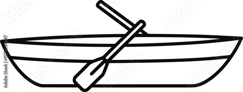 Rowboat with oar resting inside, ready for water activities.