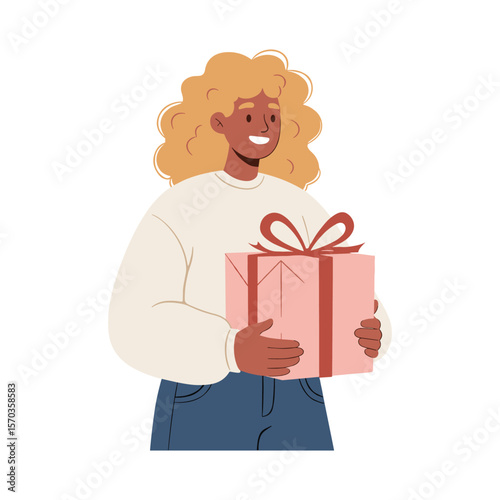 Joyful Woman with Curly Hair Holding a Pink Gift Box