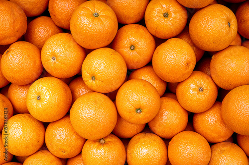 Vibrant pile of fresh tangerines ready to enjoy
