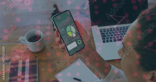 Hand holding smartphone with overlay pulsing and pointer tapping green pie slice updating data