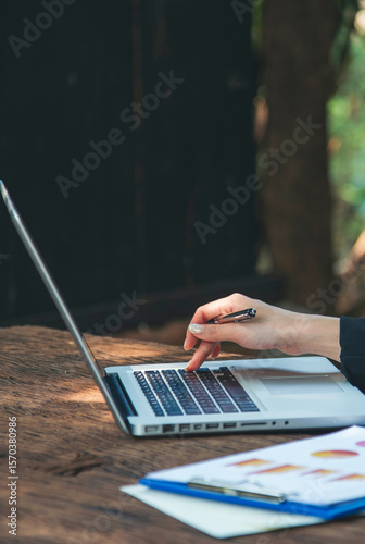 Vertical Horizon Asian Woman using laptop working from home online meeting in home office. Vertical Happy relax time asian business woman type keyboard notebook laptop at home office with copy space