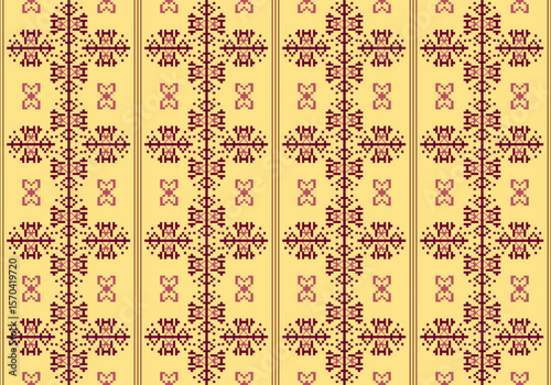 This fabric pattern uses maroon and light pink pixel designs on a warm yellow background. The symmetrical layout features butterfly and diamond-like shapes, giving it a nostalgic traditional look.