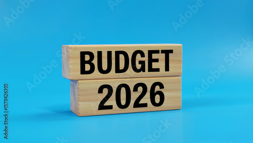 Wooden blocks stacked with the words budget and 2026 clearly printed in black against a bright blue background