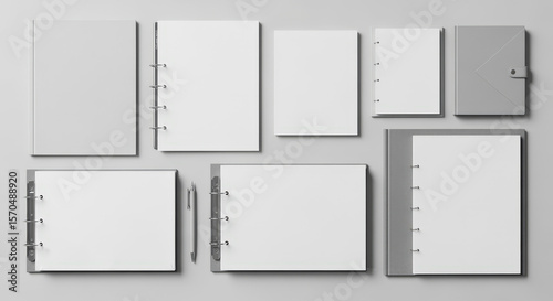 Arrangement Of Various Notebooks And Binders With Pen On White Background Overhead View