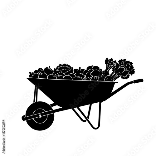 Wheelbarrow filled with fresh vegetables and leafy greens  