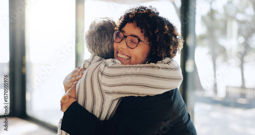 Business women, hug and happy at office with welcome, promotion or congratulations for success. People, employee and friends with embrace, thanks and excited with goals by window at insurance agency