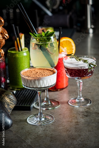 A vibrant showcase of flavorful cocktails and desserts at a stylish bar