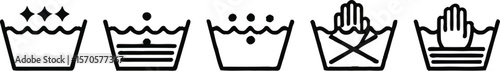 Laundry symbols on a fabric with washing instructions shown in black on a white background surface