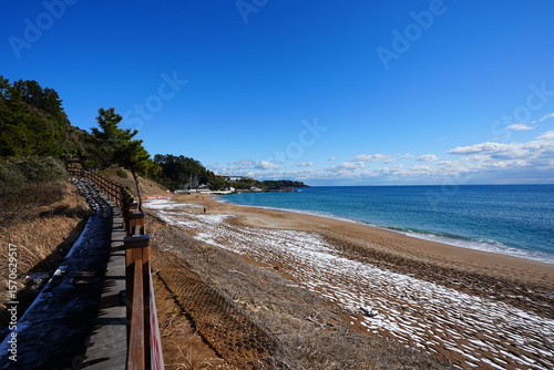 winter seascape with snow and walkway