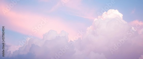 Soft pastel blue and pink sky with fluffy white clouds, dreamy atmosphere, calm, color