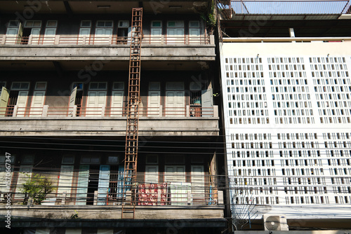 Contrasting Old and New Buildings with a Fire Escape in Bangkok