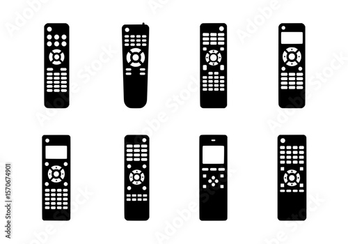 Vector silhouette of a collection of eight black remote controls isolated on a white background