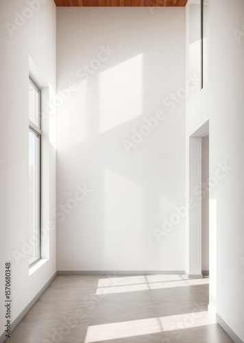 Empty corner of minimalist living room with natural lighting large window fills room with sunlight casting shadows on wall neutral tones create calm stylish interior design perfect for real Empty