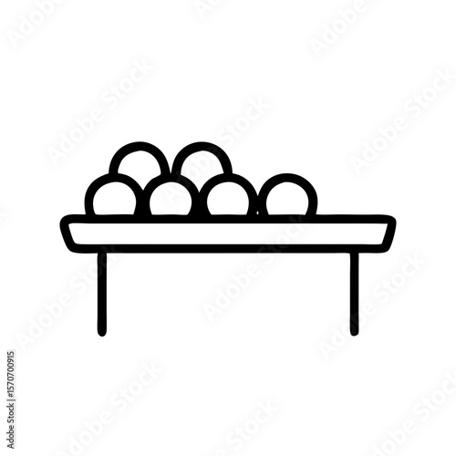 Fruit sorting table with round fruits displayed in a line  