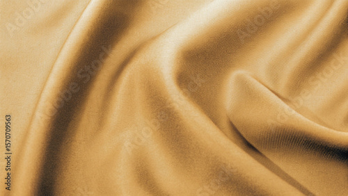 Golden, soft silk satin fabric with a smooth, shiny texture creates a luxurious and elegant golden textile background pattern