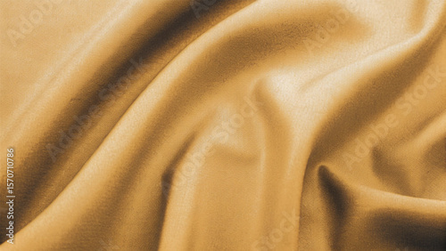 Golden, soft silk satin fabric with a smooth, shiny texture creates a luxurious and elegant golden textile background pattern