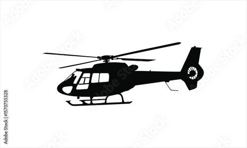 Helicopter flying through sky silhouette