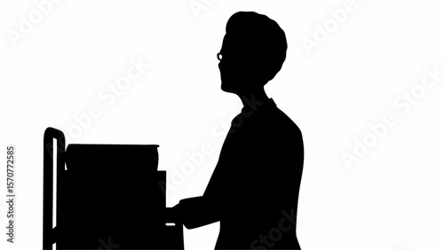 Silhouette of a person with glasses playing a piano in a side view against a white color background