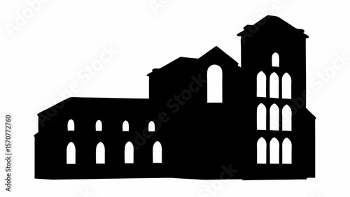 Silhouette of a complex building structure with multiple arched windows and a prominent tower element