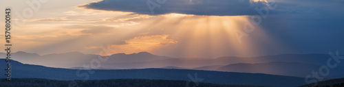 Sunset sky in the mountains, panoramic view	