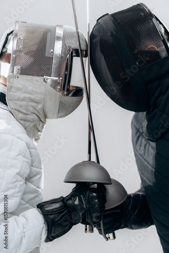 Canvas Print Two Fencers in Action Face Off During a Practice Duel
