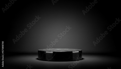A dark round podium or stage is centered in a dimly lit black background designed to fit aesthetic product showcases with soft tones