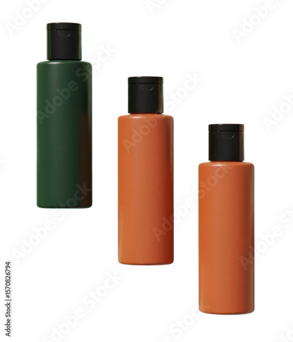 Orange and green cosmetic bottles with black caps isolated on white background