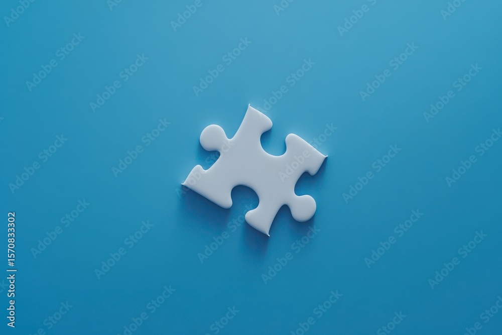 Obraz premium A white puzzle piece is on a blue background. The puzzle piece is missing a corner, and it is the only piece visible. Concept of emptiness and loneliness, as the puzzle piece is incomplete