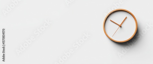 A clock with the hands on the number 3 and 9. The clock is on a white background