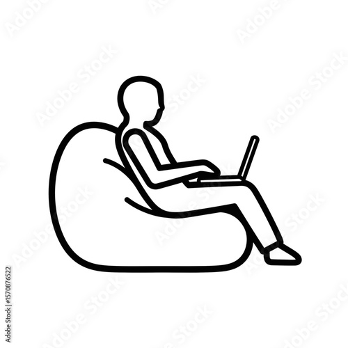 Remote worker using laptop while sitting on bean bag chair  