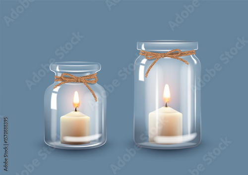 Set of empty transparent glass jars with candles
