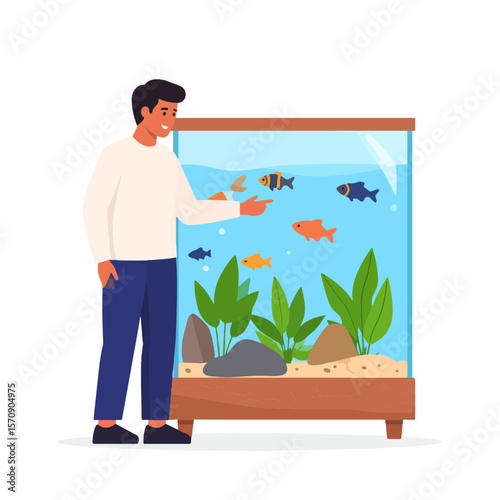 A man points and smiles at a colorful aquarium filled with various fish, plants, rocks, and sand, enjoying the serene underwater world of his home aquarium.