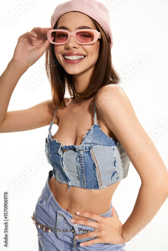 Stylish woman radiates confidence in vibrant fashionable attire during a photoshoot session