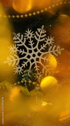 Elegant White Snowflake on a Christmas tree with Blurred Holiday Lights, Vertical Video