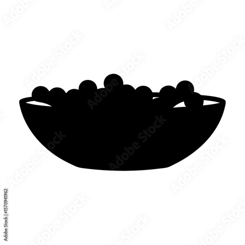 Silhouette of a bowl filled with round objects, against a white backdrop